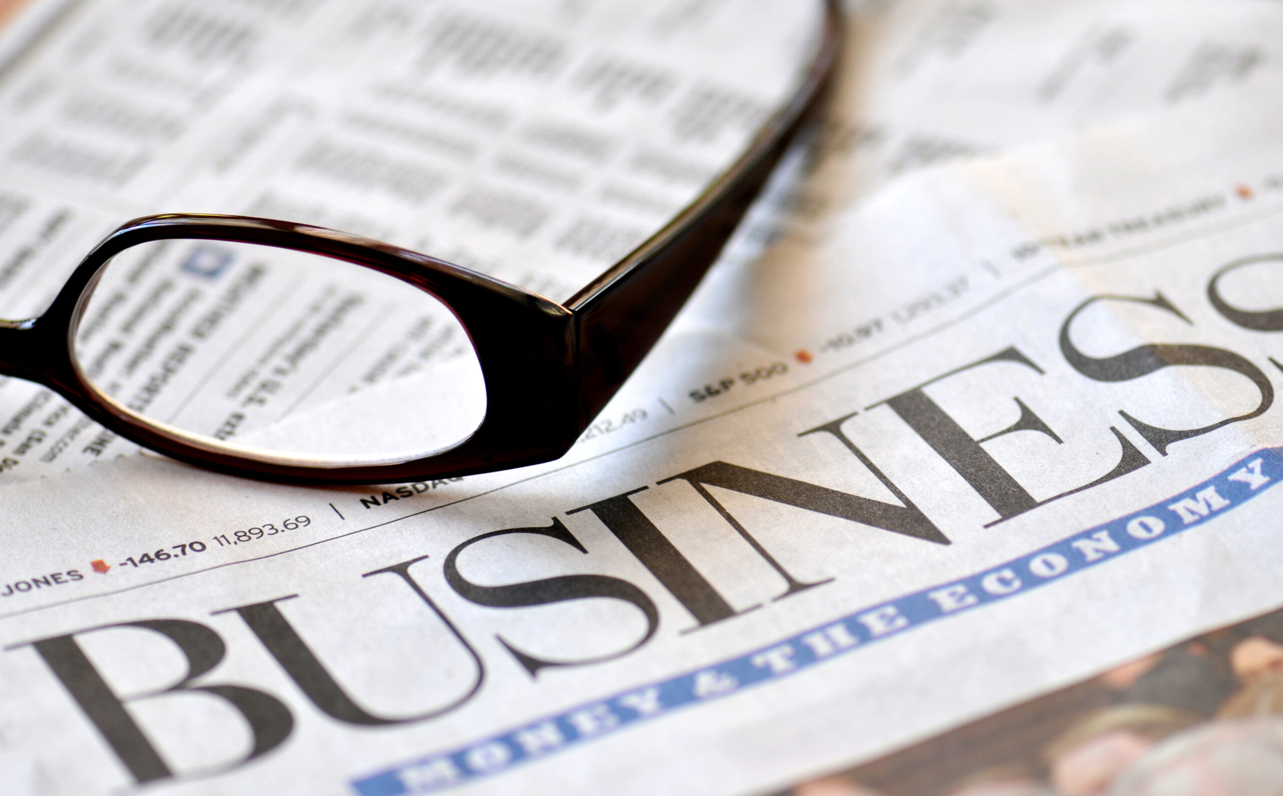 Business section and glasses