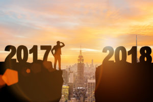 Businessman looking forward to 2018 from 2017